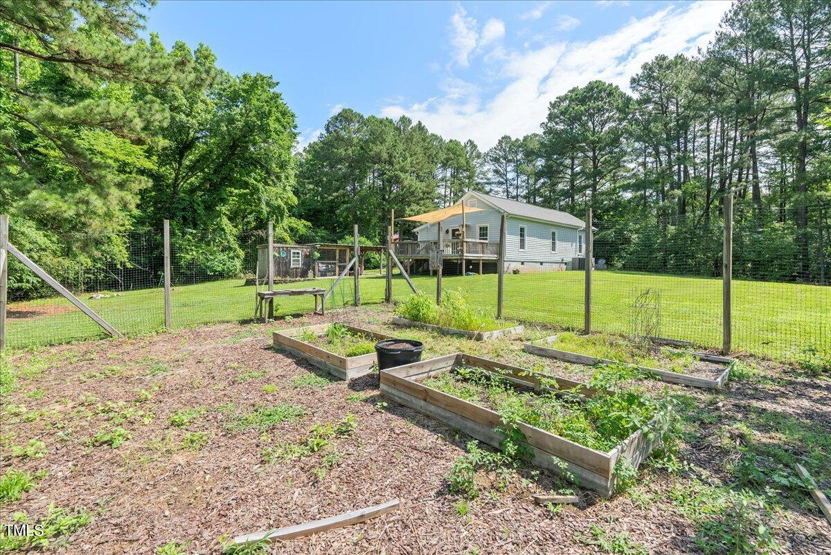 3151 Brogden Road Stem, NC 27581 - Photo 31 of 58 a view of a house with backyard and sitting area