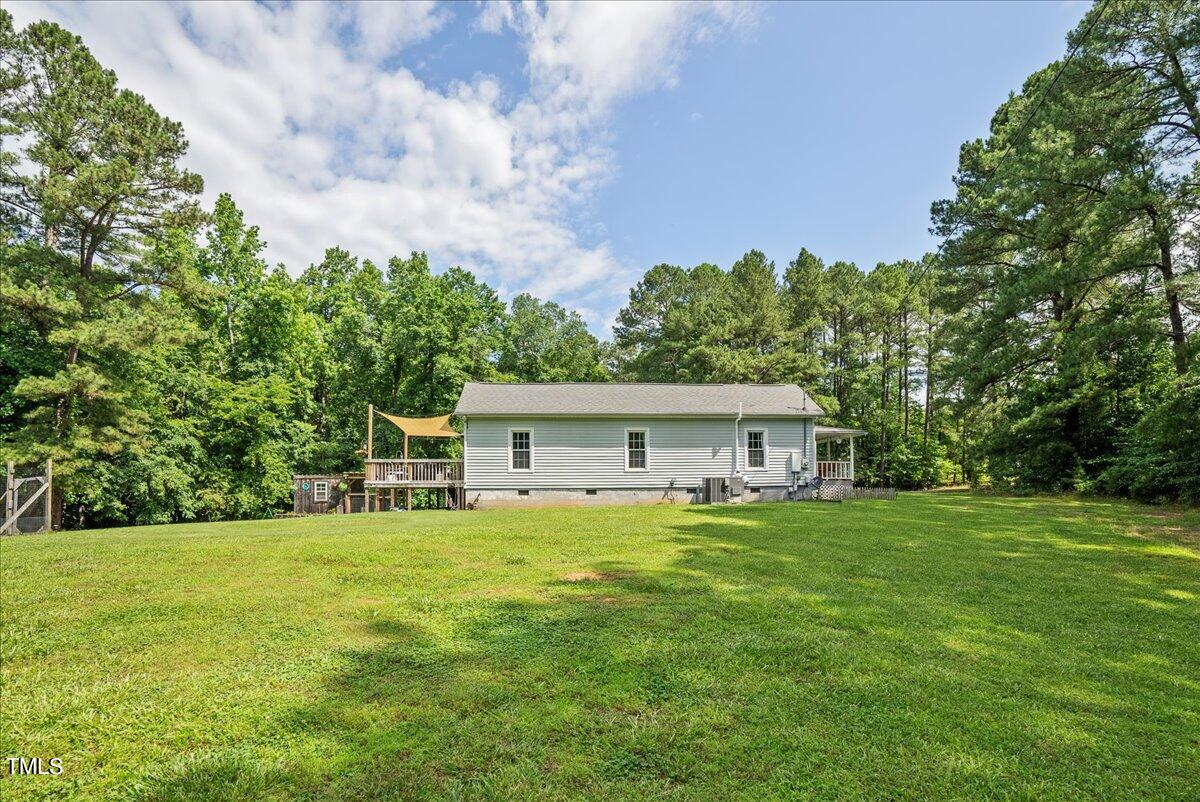 3151 Brogden Road Stem, NC 27581 - Photo 45 of 58 a house view with a sitting space and garden