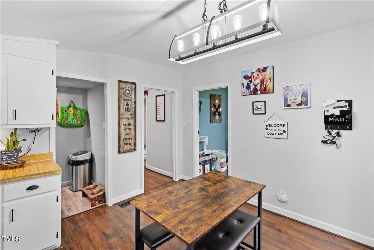3151 Brogden Road Stem, NC 27581 - Photo 10 of 58 a view of a workspace with furniture and wooden floor