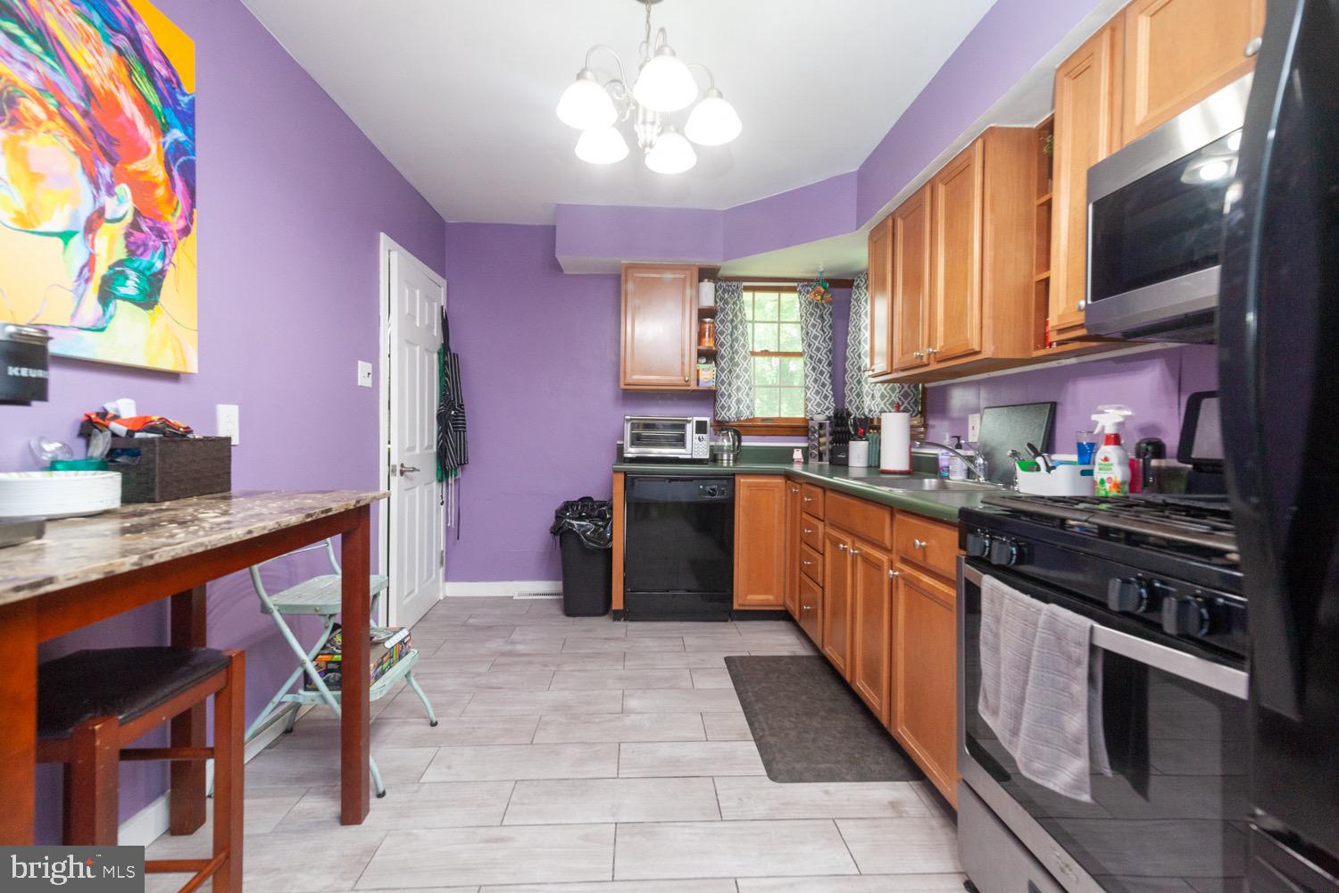 505 Jefferson Street Riverside, NJ 08075 - Photo 8 of 26 a large kitchen with stainless steel appliances granite countertop a sink and cabinets