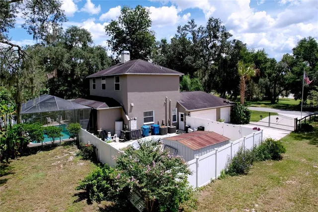 a living room with furniture a window and wooden floor