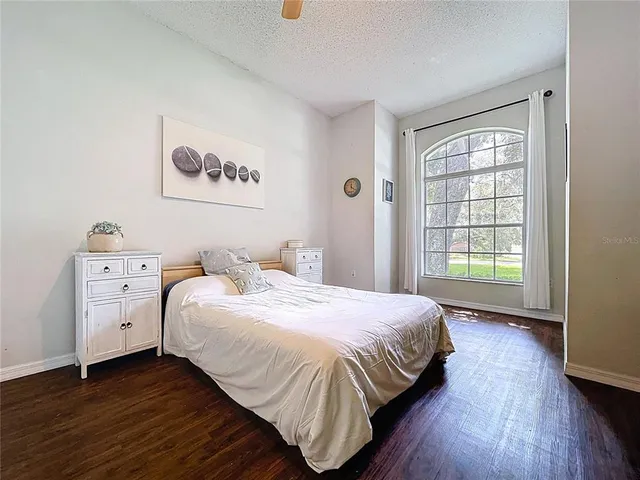 a view of an outdoor dining space with furniture and umbrella