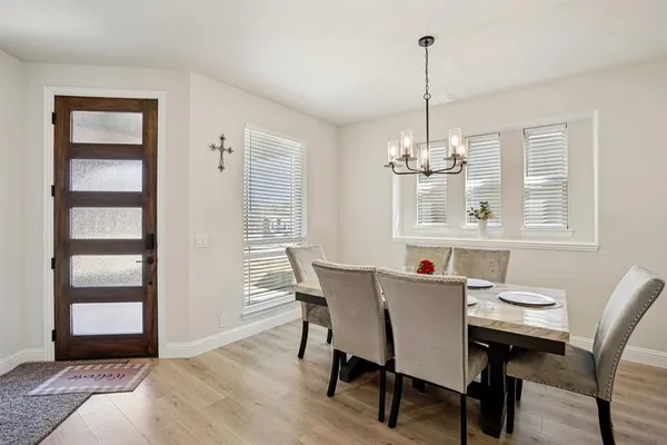 a view of a dining room with furniture window and outside view