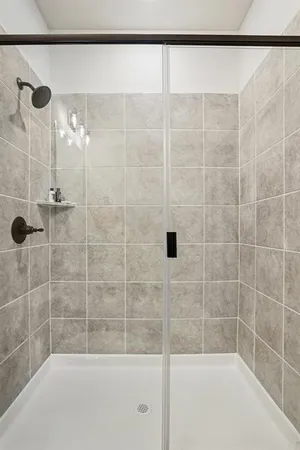 a bathroom with a shower and a bathtub