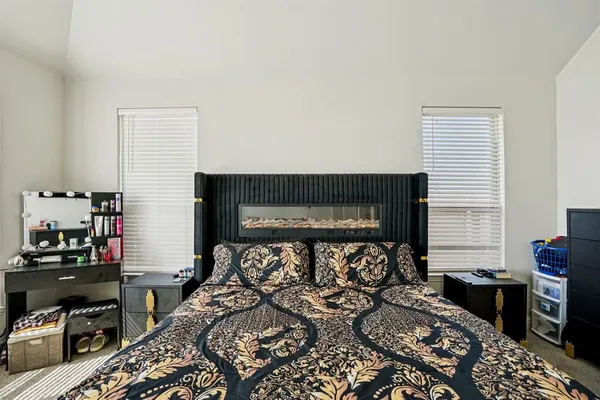 a bedroom with a bed and a tv in it