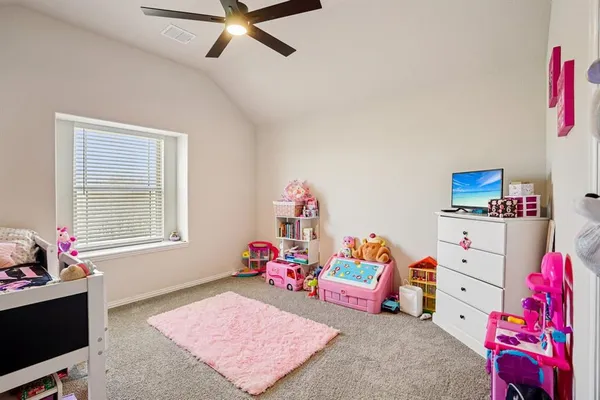 a bedroom with furniture and a bed