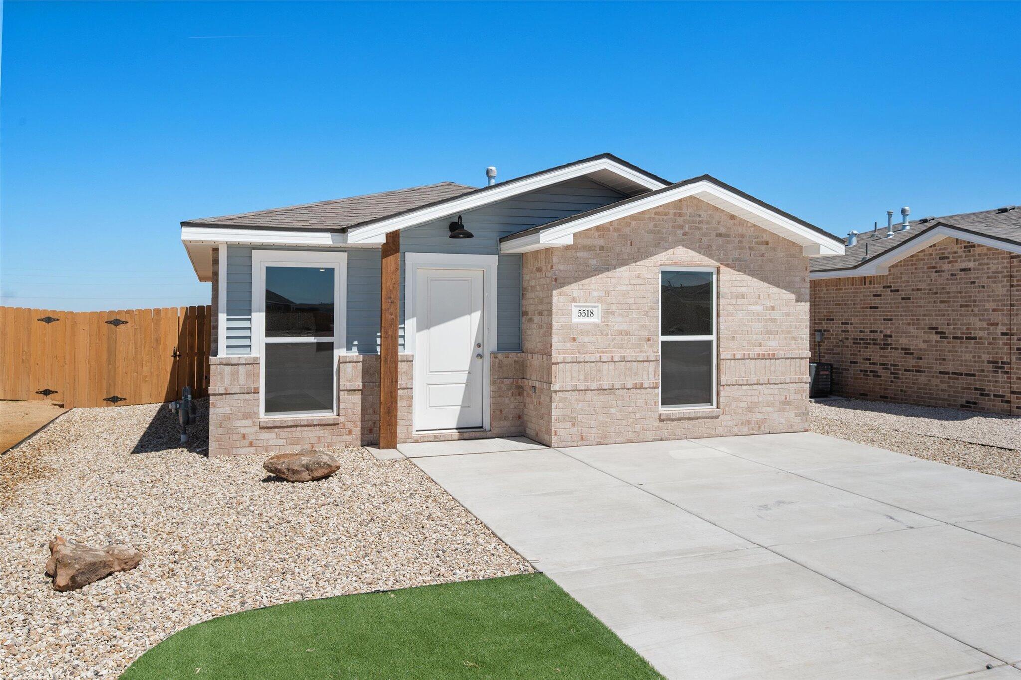 5518 Smith Street Lubbock, TX 79416 - Photo 1 of 22 a front view of a house with a yard