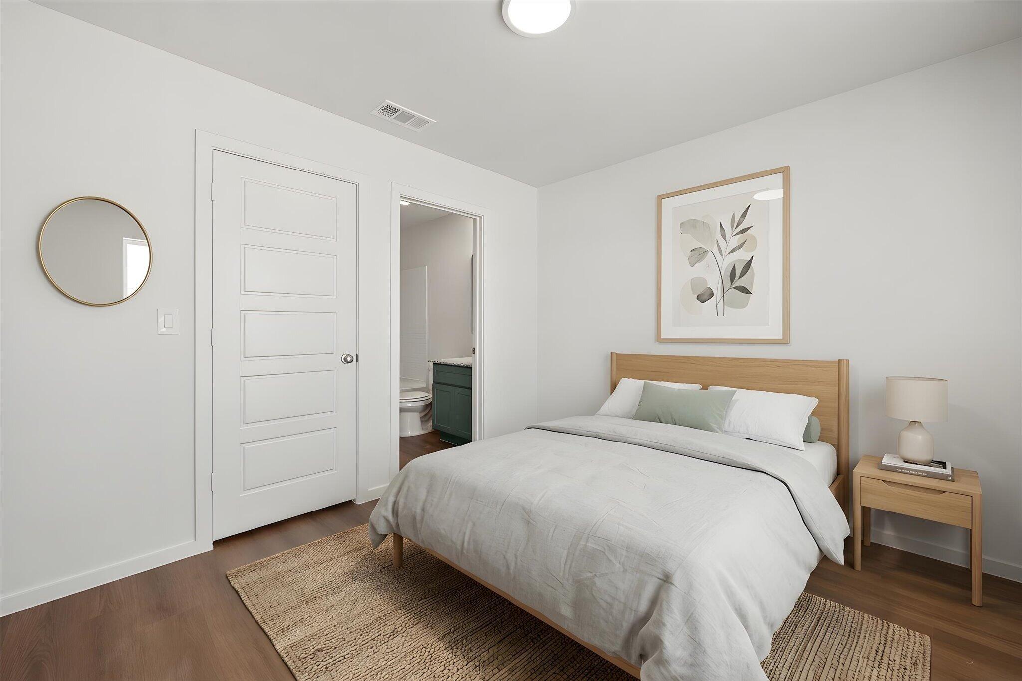 5518 Smith Street Lubbock, TX 79416 - Photo 15 of 22 a bedroom with a bed and a painting on the wall