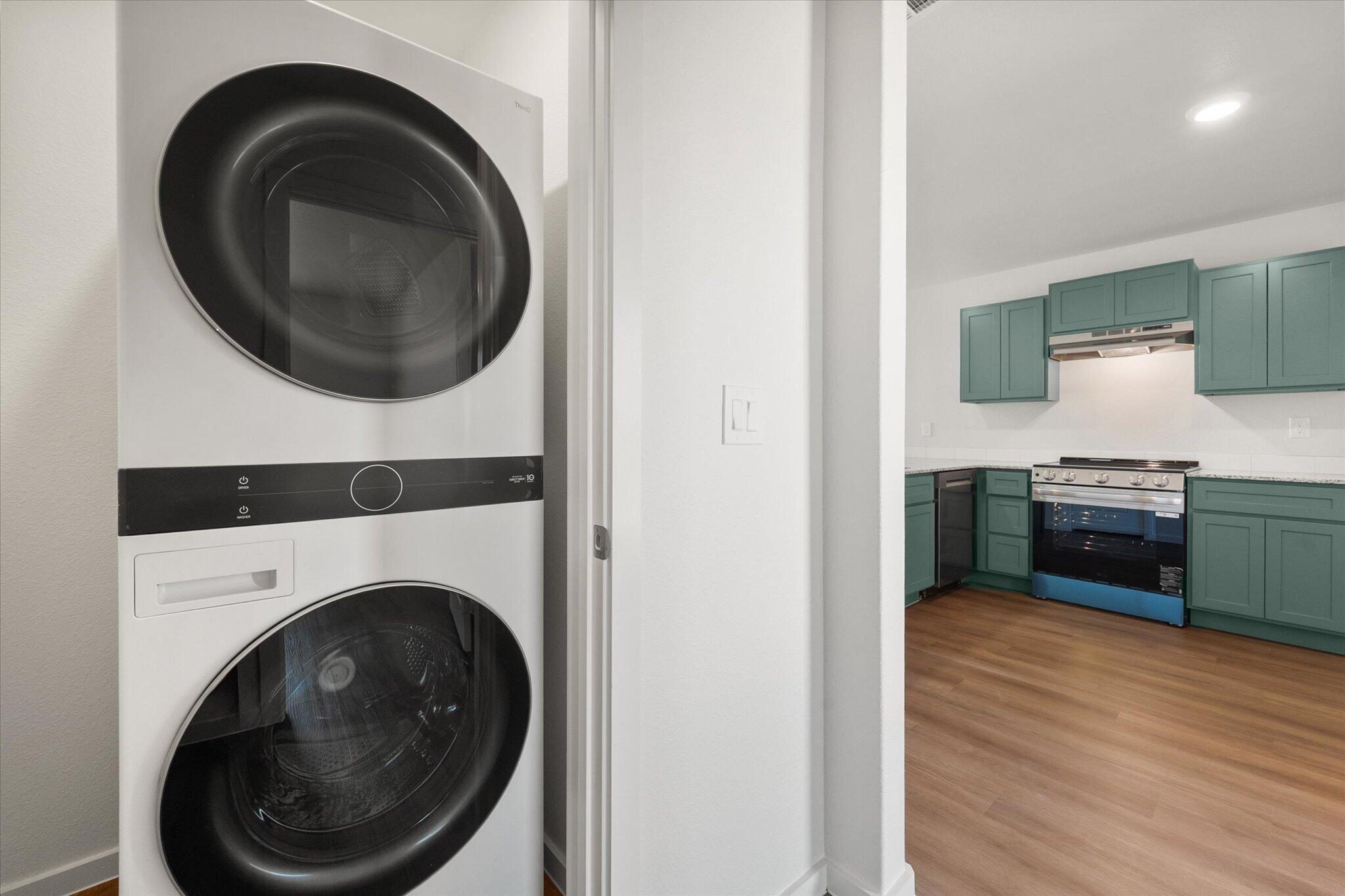5518 Smith Street Lubbock, TX 79416 - Photo 21 of 22 a view of a kitchen with washer and dryer
