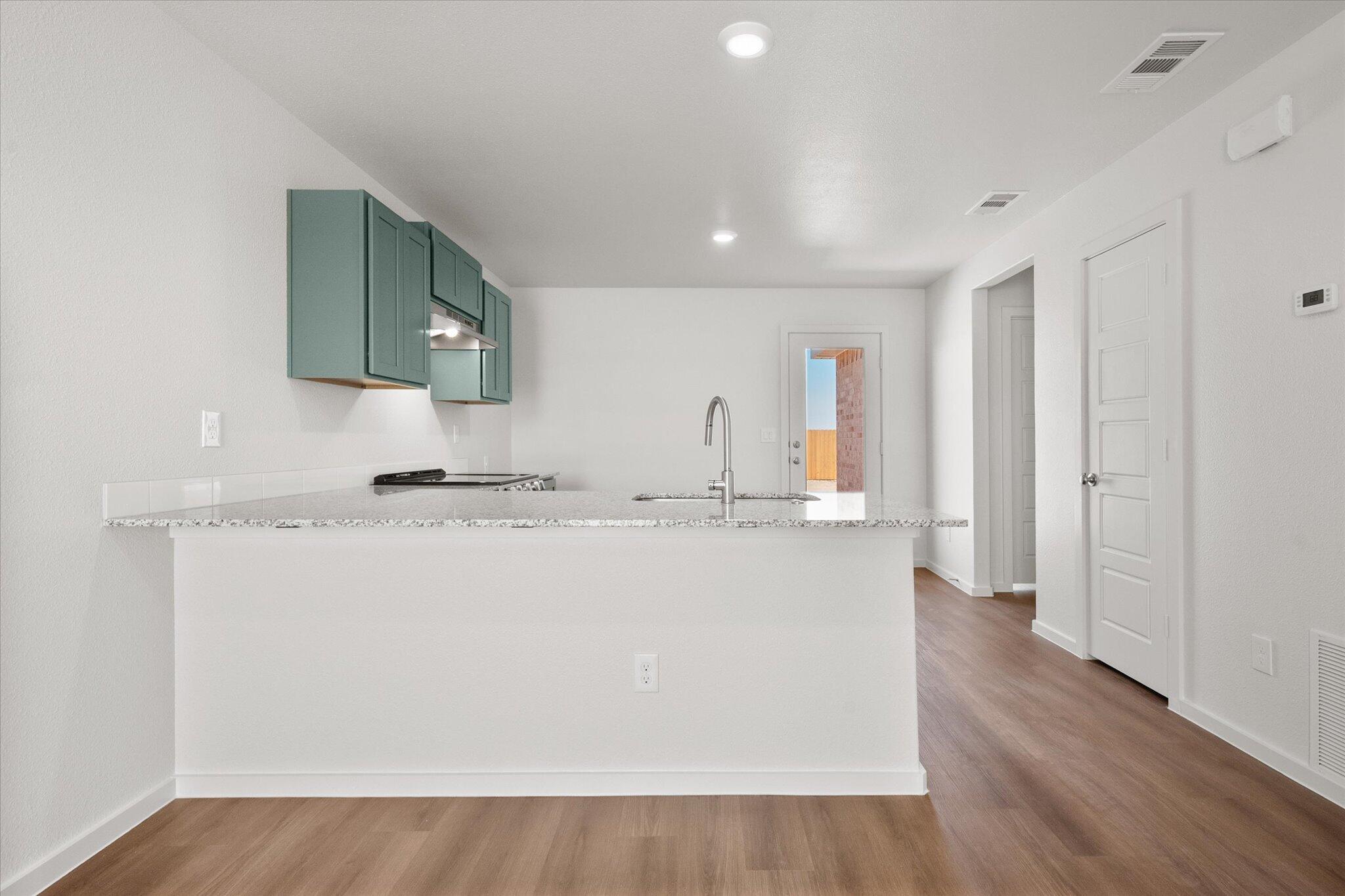 5518 Smith Street Lubbock, TX 79416 - Photo 9 of 22 a view of kitchen with wooden floor