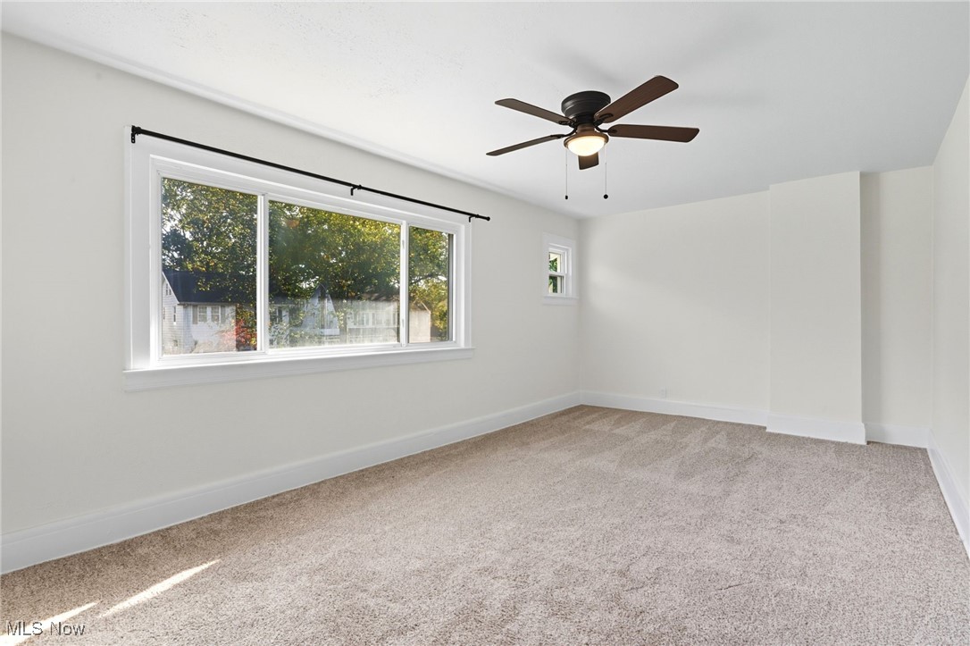 3359 Altamont Road Cleveland, OH 44118 - Photo 19 of 31 Empty room featuring light carpet and ceiling fan
