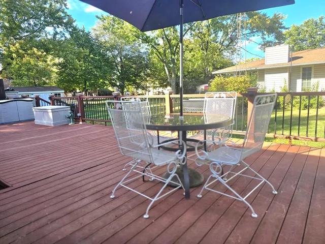 a view of a house with wooden fence