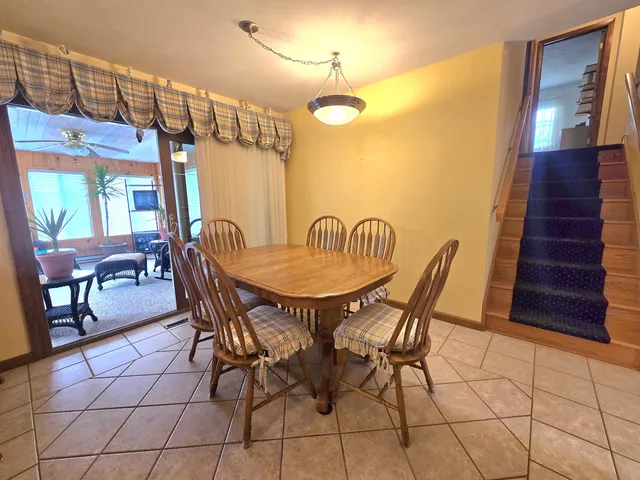 a view of a dining room with furniture and window