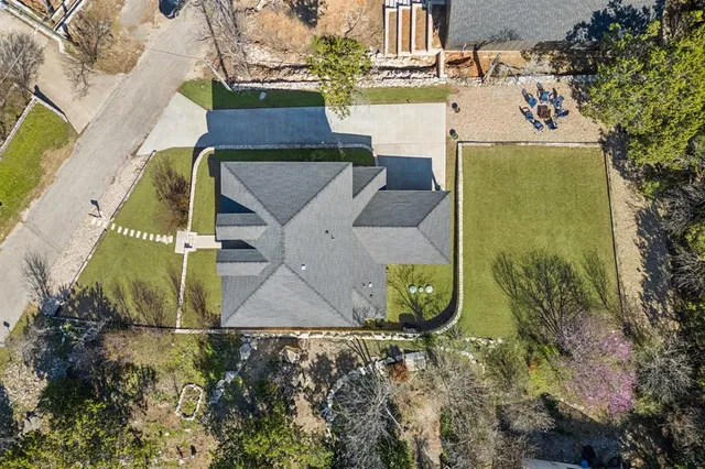 an aerial view of a house with a ocean view