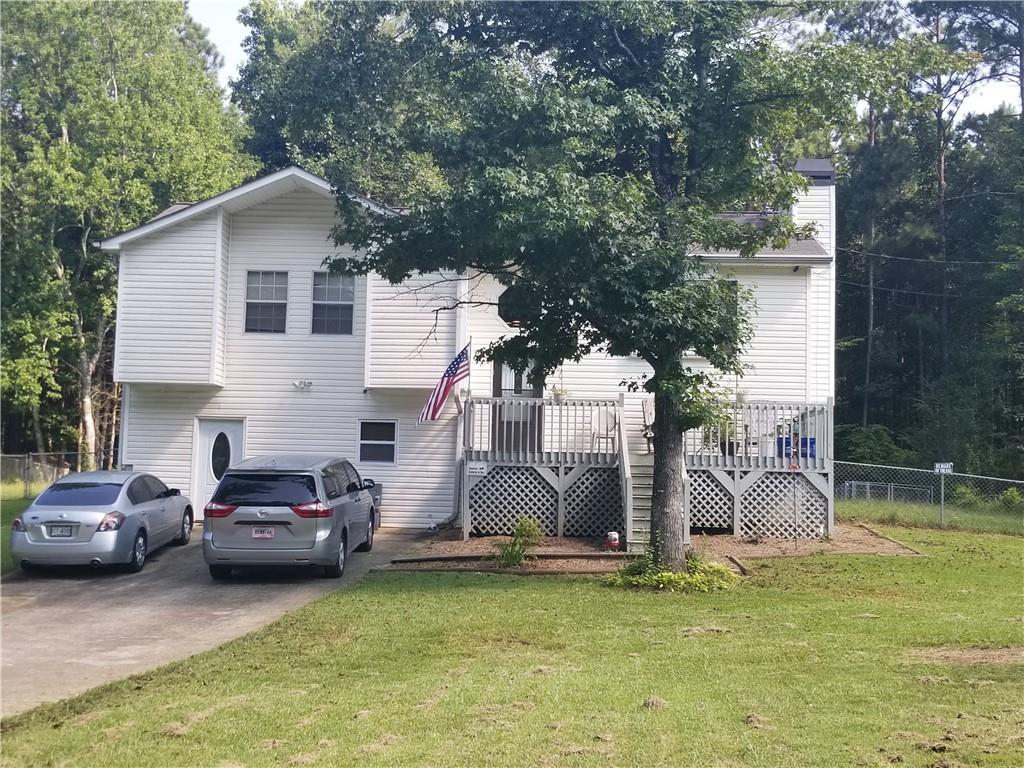 76 Adelene Way Dallas, GA 30157 - Photo 1 of 1 a couple of cars parked in front of a house