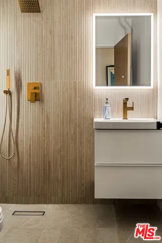 a bathroom with a sink and a mirror