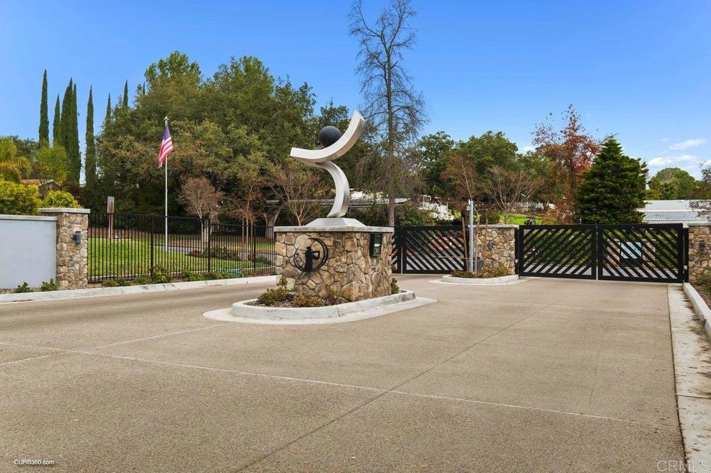 18218 Paradise Mountain Road, Unit 220 Valley Center, CA 92082 - Photo 9 of 48 a view of a park with iron fence