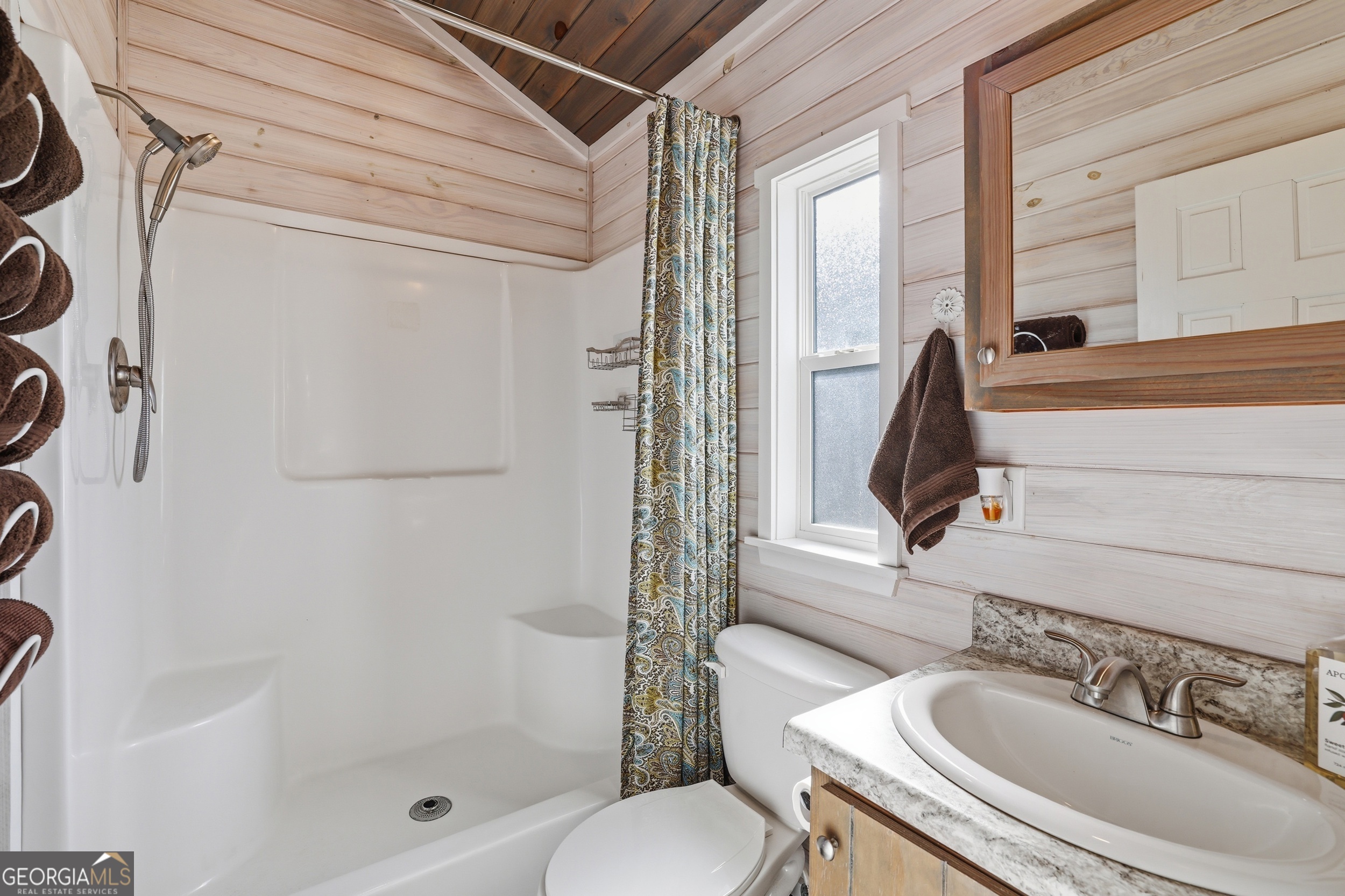 4960 Laurel Lodge Road, Unit 35 Clarkesville, GA 30523 - Photo 15 of 20 a bathroom with a sink a toilet and shower