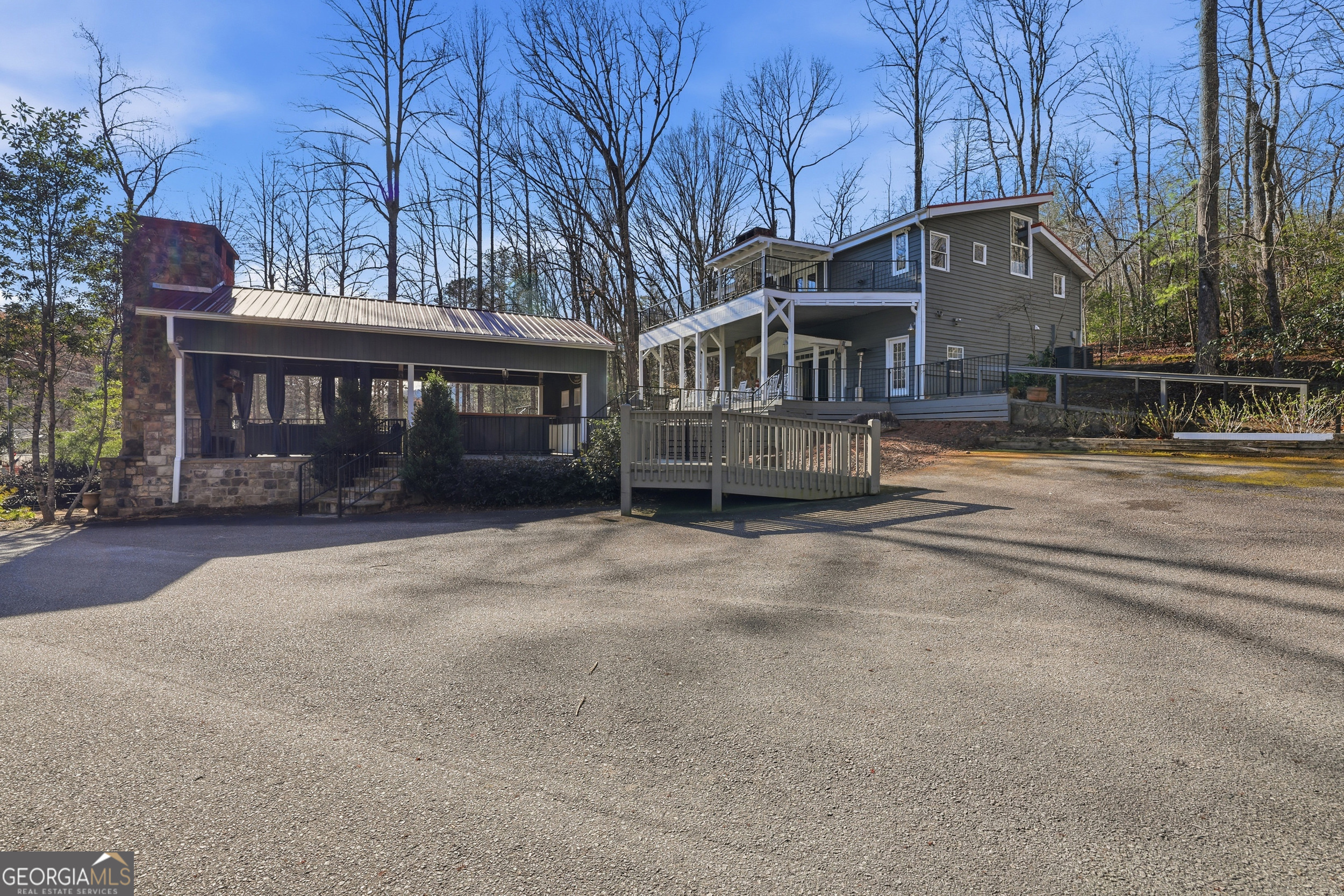 4960 Laurel Lodge Road, Unit 35 Clarkesville, GA 30523 - Photo 17 of 20 a front view of a house with a garden