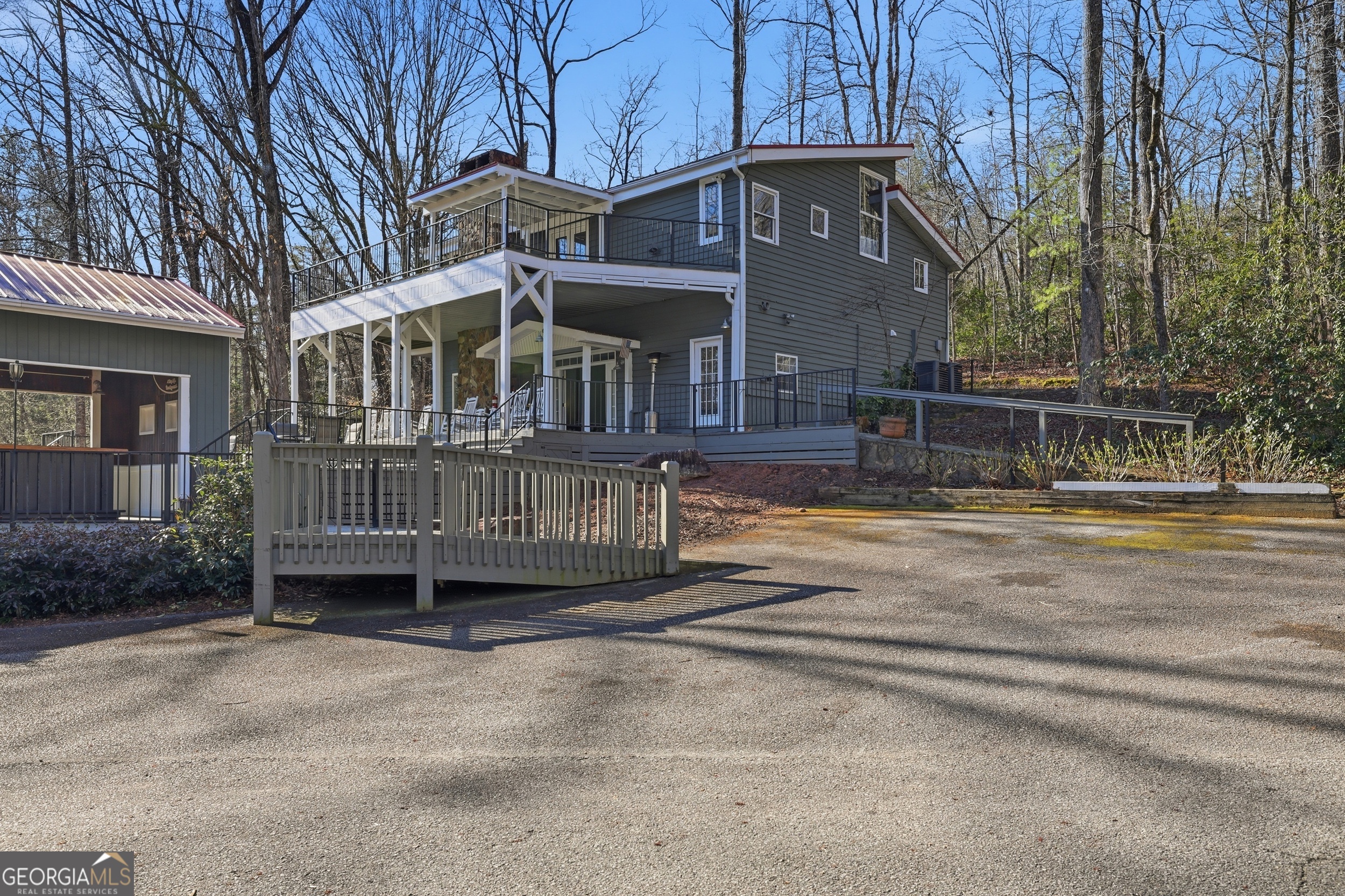 4960 Laurel Lodge Road, Unit 35 Clarkesville, GA 30523 - Photo 18 of 20 a view of a house with a balcony and yard