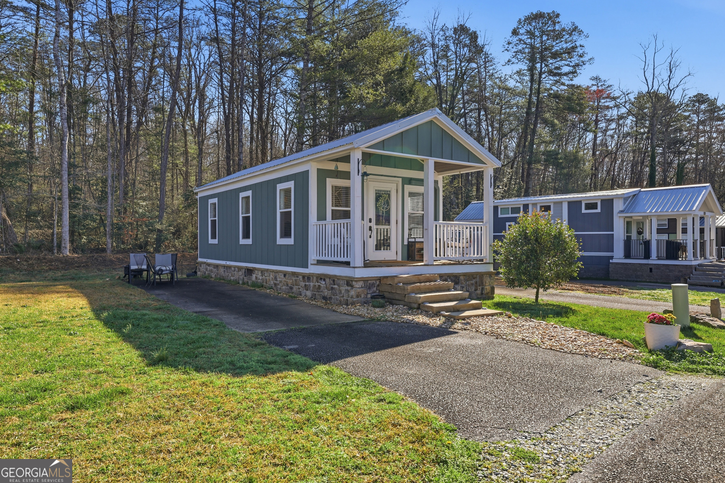 4960 Laurel Lodge Road, Unit 35 Clarkesville, GA 30523 - Photo 2 of 20 a front view of a house with garden