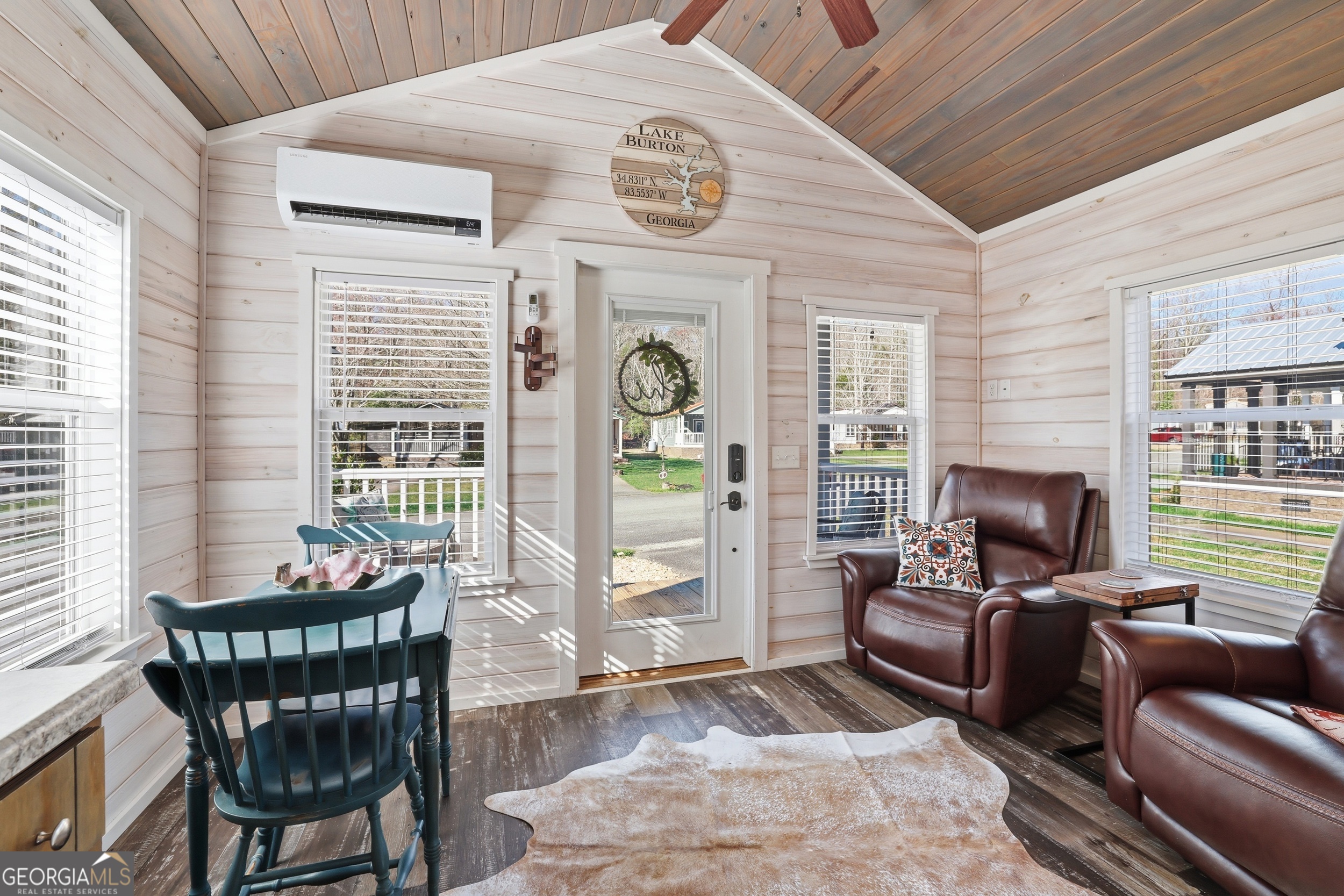 4960 Laurel Lodge Road, Unit 35 Clarkesville, GA 30523 - Photo 9 of 20 a living room with furniture a fireplace and a table