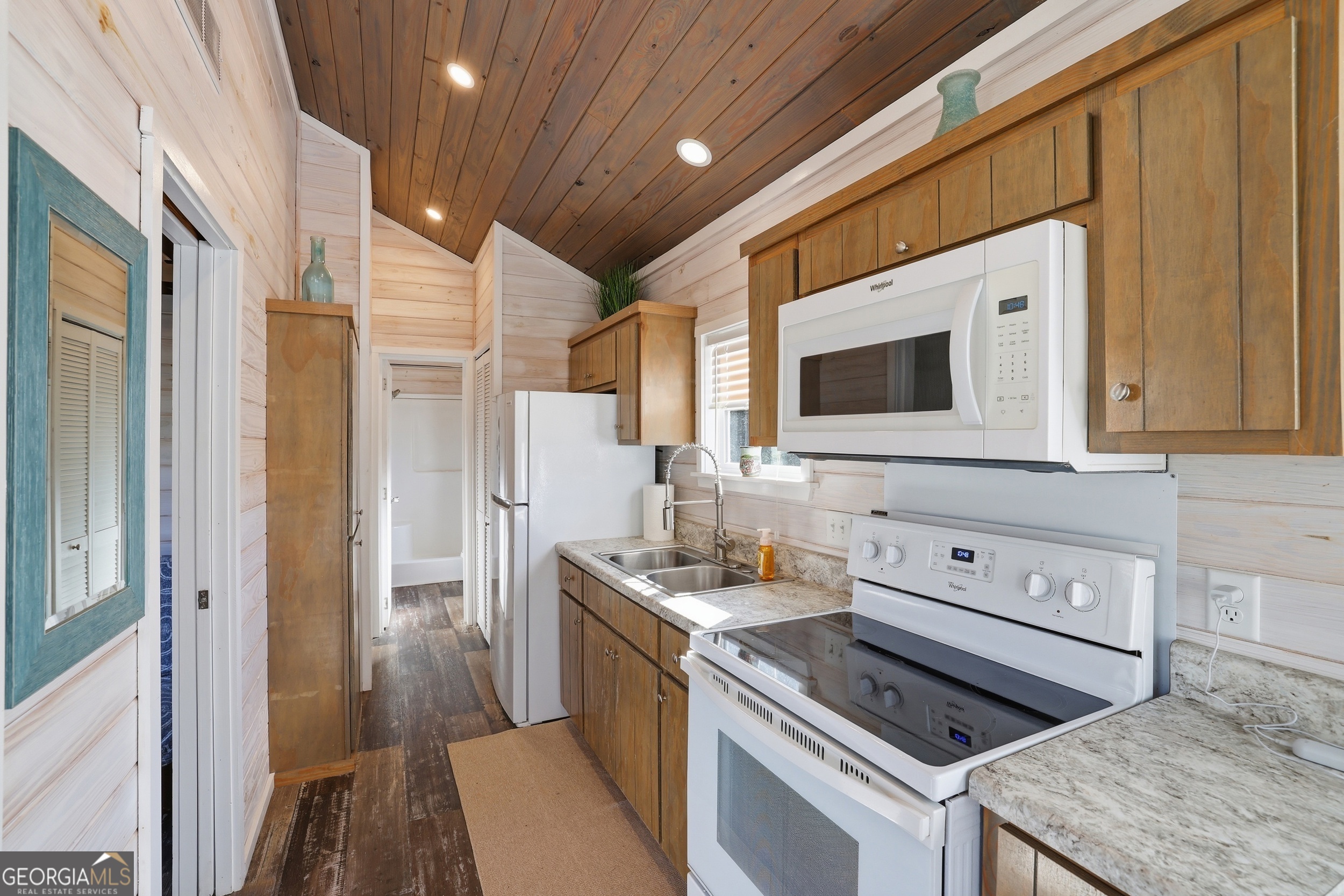 4960 Laurel Lodge Road, Unit 35 Clarkesville, GA 30523 - Photo 10 of 20 a kitchen that has a sink and a stove in it
