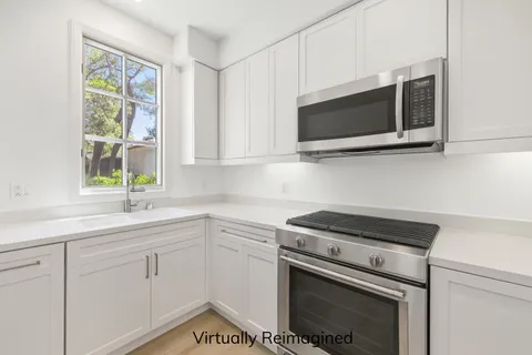 a bathroom with a tub and toilet