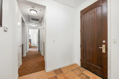 a living room with furniture a fireplace and wooden floor