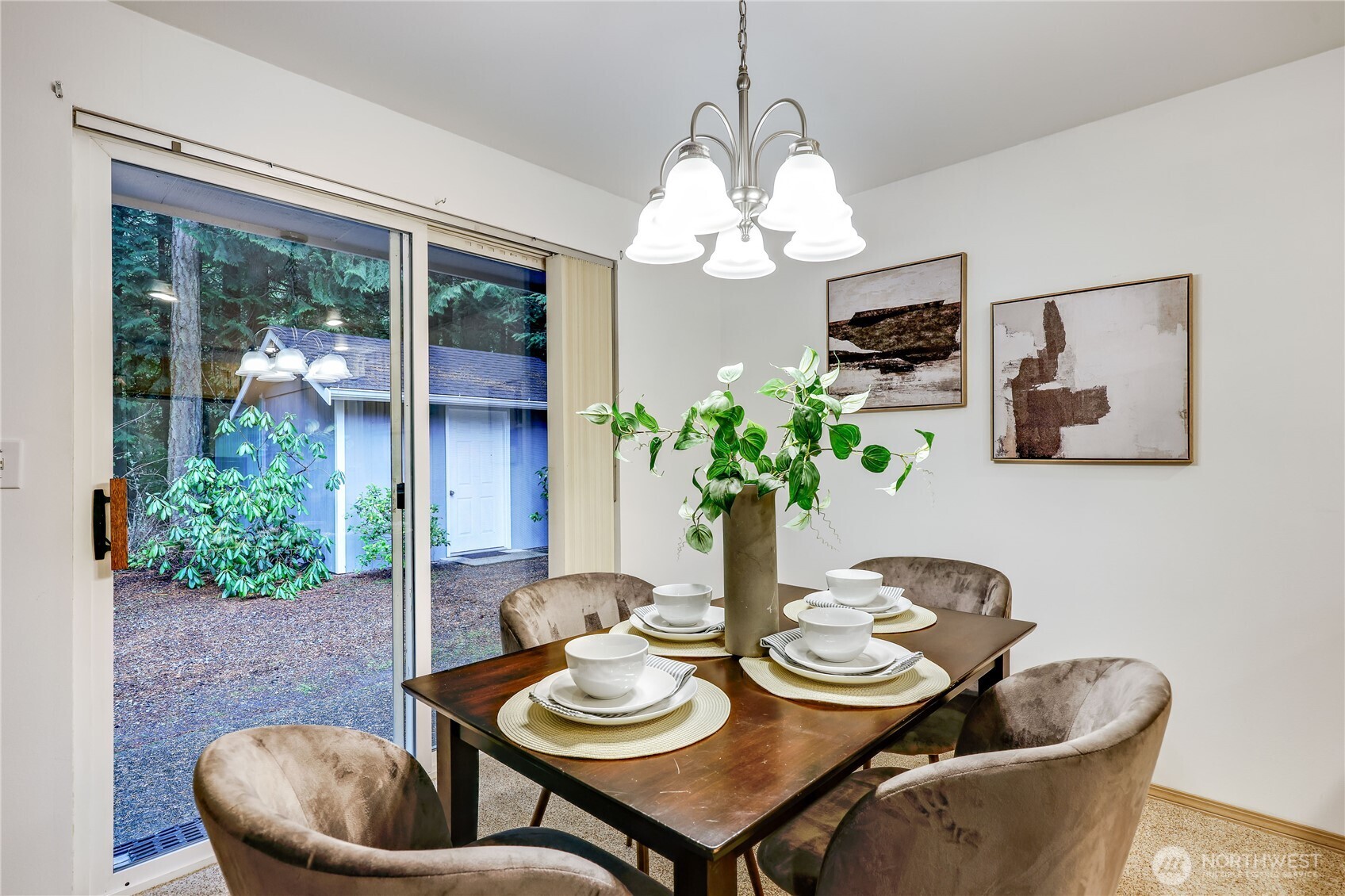 43 Rhody Court Chimacum, WA 98325 - Photo 15 of 37 a view of a dining room with furniture a chandelier and wooden floor