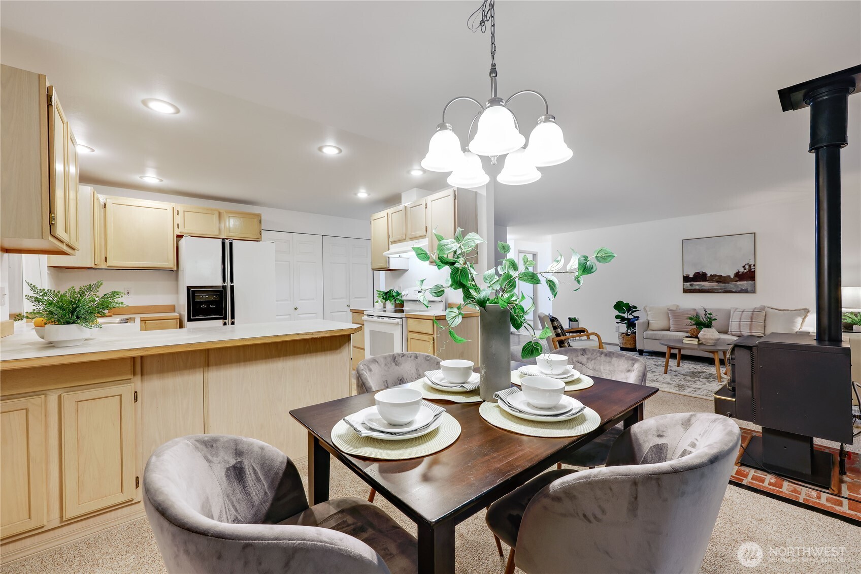43 Rhody Court Chimacum, WA 98325 - Photo 16 of 37 a view of a dining room with furniture a chandelier and wooden floor