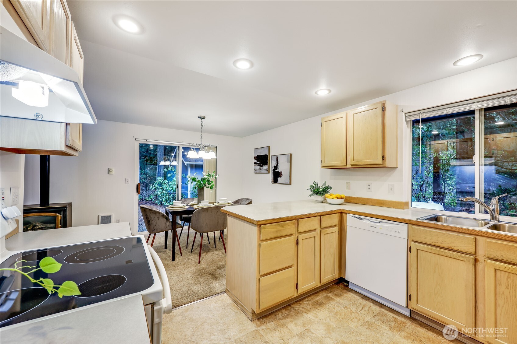 43 Rhody Court Chimacum, WA 98325 - Photo 18 of 37 a kitchen that has a sink and chairs in it