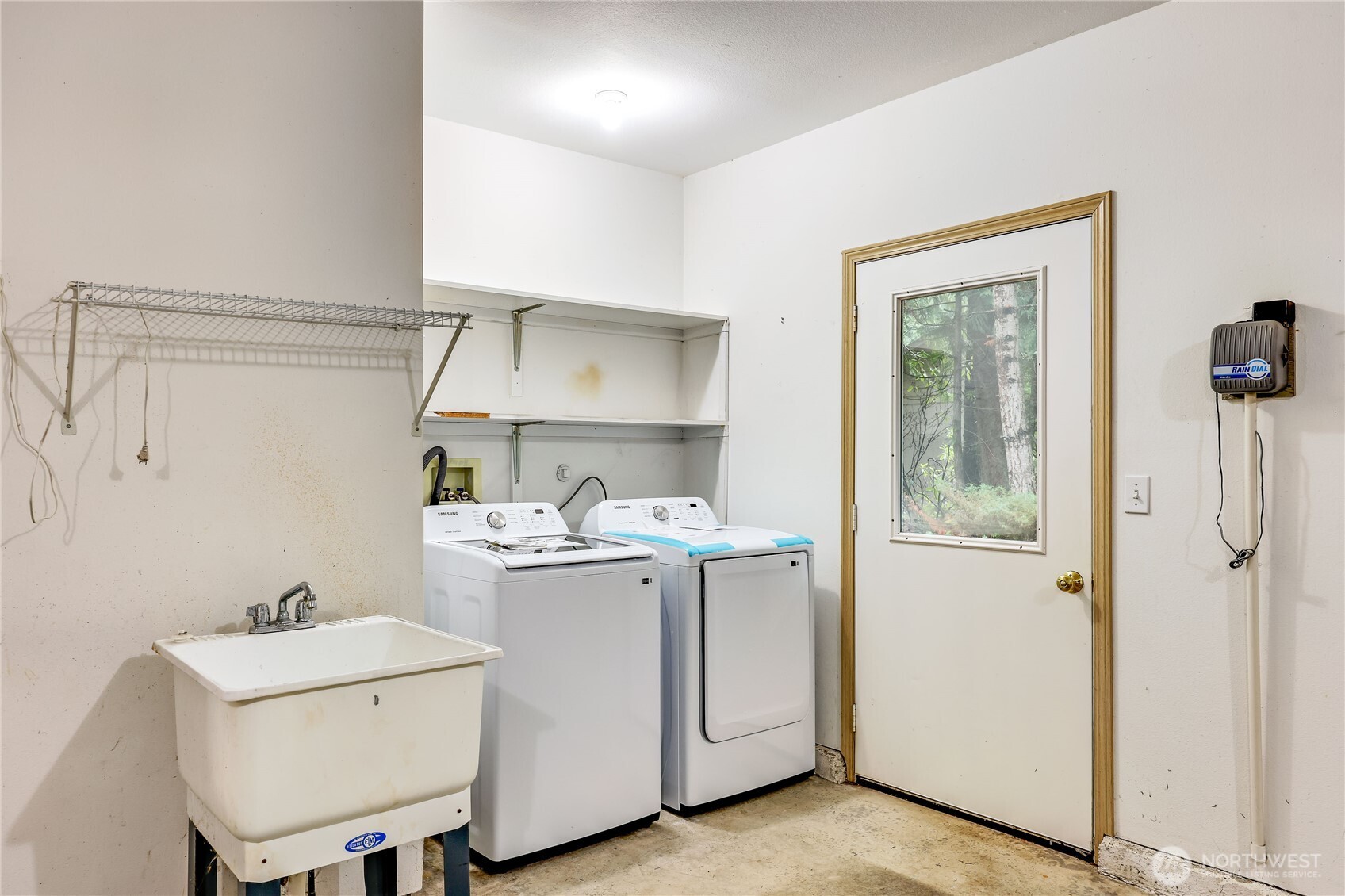 43 Rhody Court Chimacum, WA 98325 - Photo 21 of 37 a view of kitchen with white cabinets and wooden floor