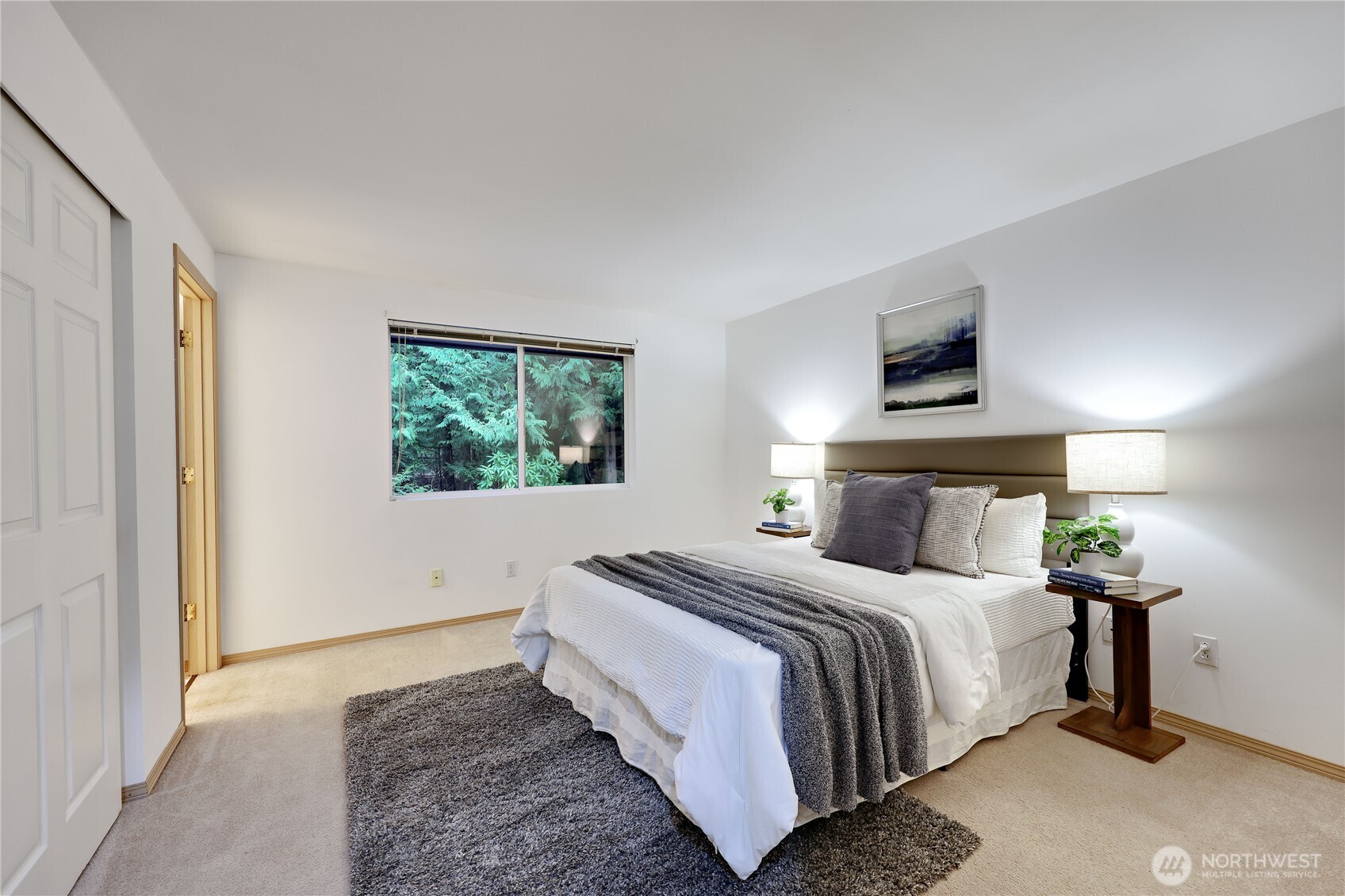 43 Rhody Court Chimacum, WA 98325 - Photo 29 of 37 a bedroom with a bed and a painting on the wall
