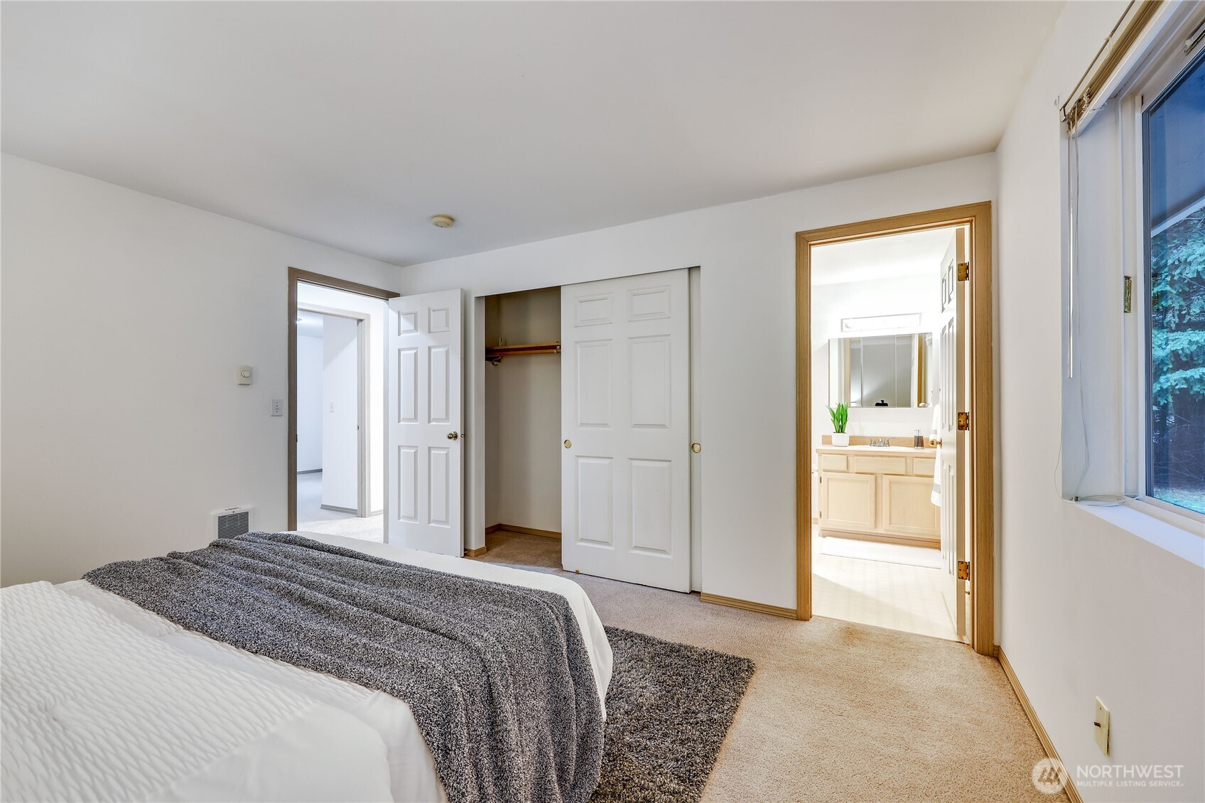 43 Rhody Court Chimacum, WA 98325 - Photo 30 of 37 a bedroom with a bed and a view of bathroom