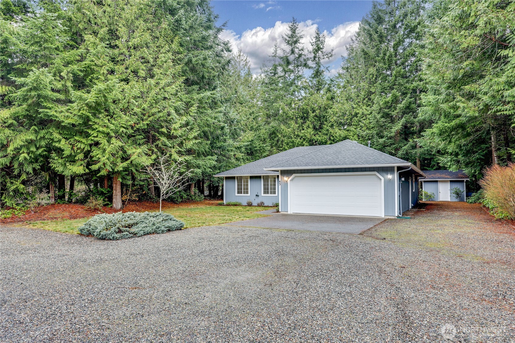 43 Rhody Court Chimacum, WA 98325 - Photo 37 of 37 a front view of a house with a yard and garage