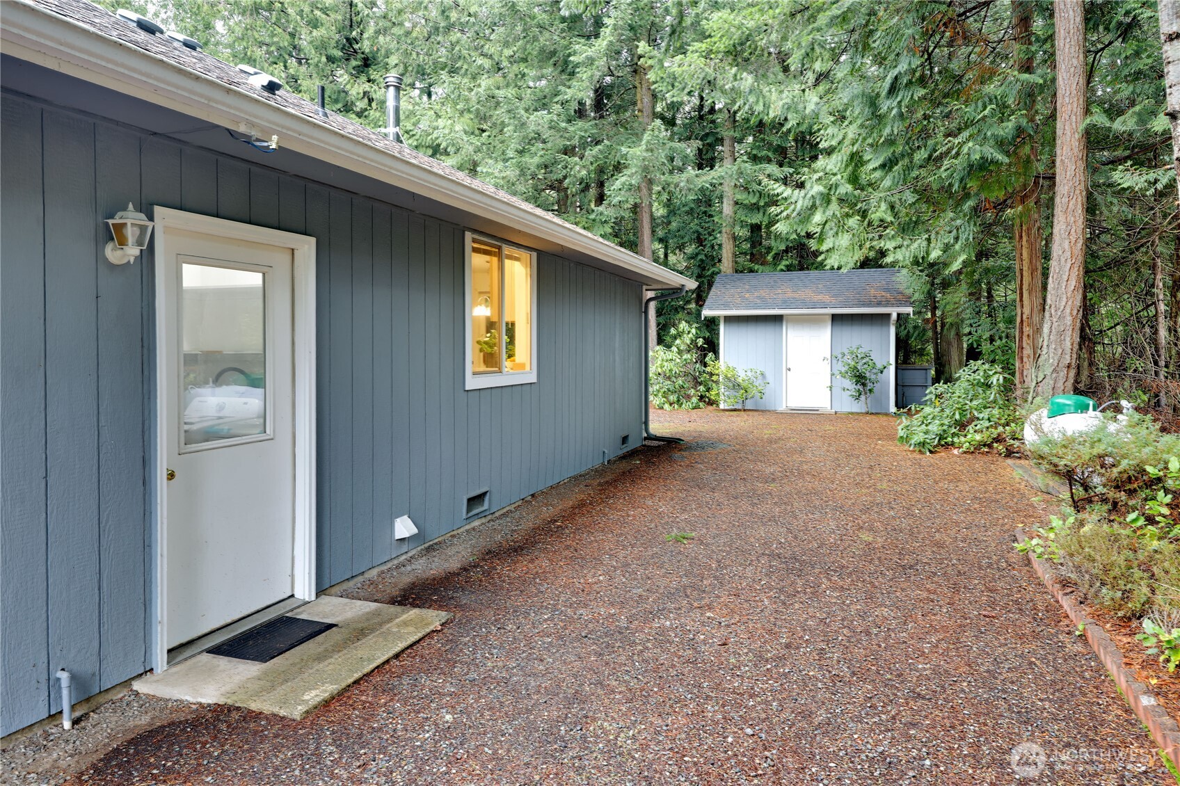 43 Rhody Court Chimacum, WA 98325 - Photo 4 of 37 a view of an house with backyard space and garden