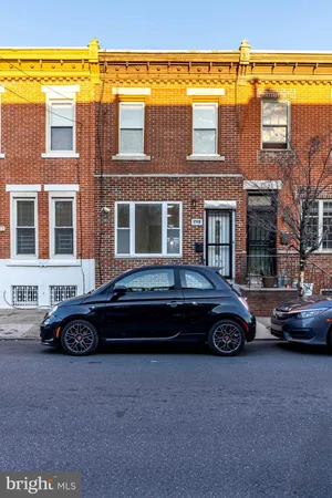 a car parked in front of a building
