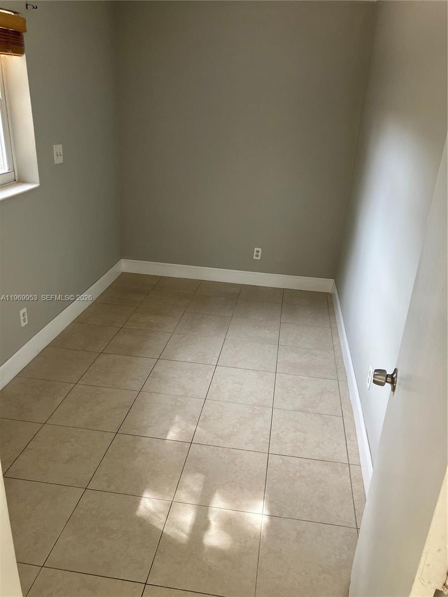 5730 Southwest 37th Street Davie, FL 33314 - Photo 12 of 20 a view of a room with an empty space and a window