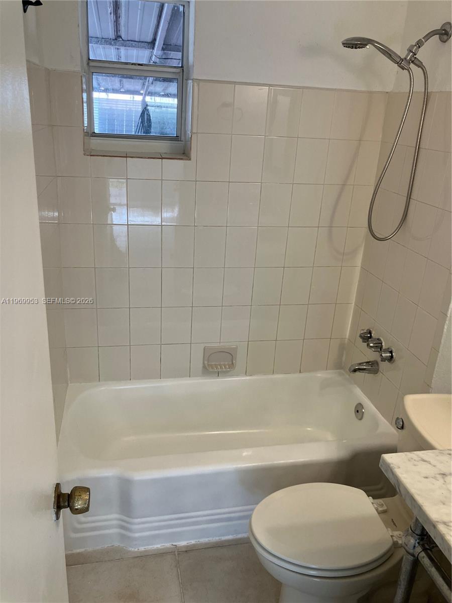 5730 Southwest 37th Street Davie, FL 33314 - Photo 15 of 20 a bathroom with a toilet and a bath tub