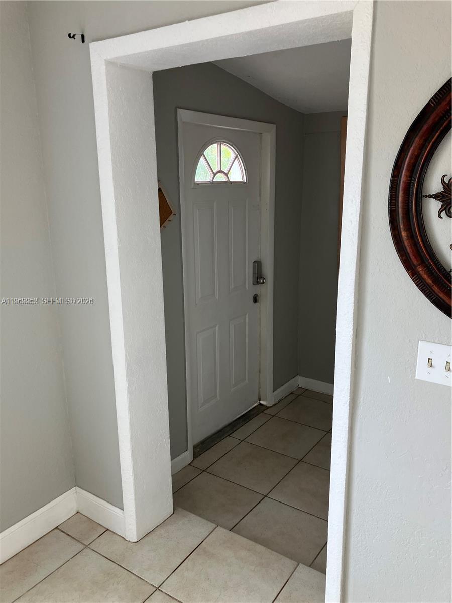 5730 Southwest 37th Street Davie, FL 33314 - Photo 3 of 20 a view of a hallway with washer and dryer