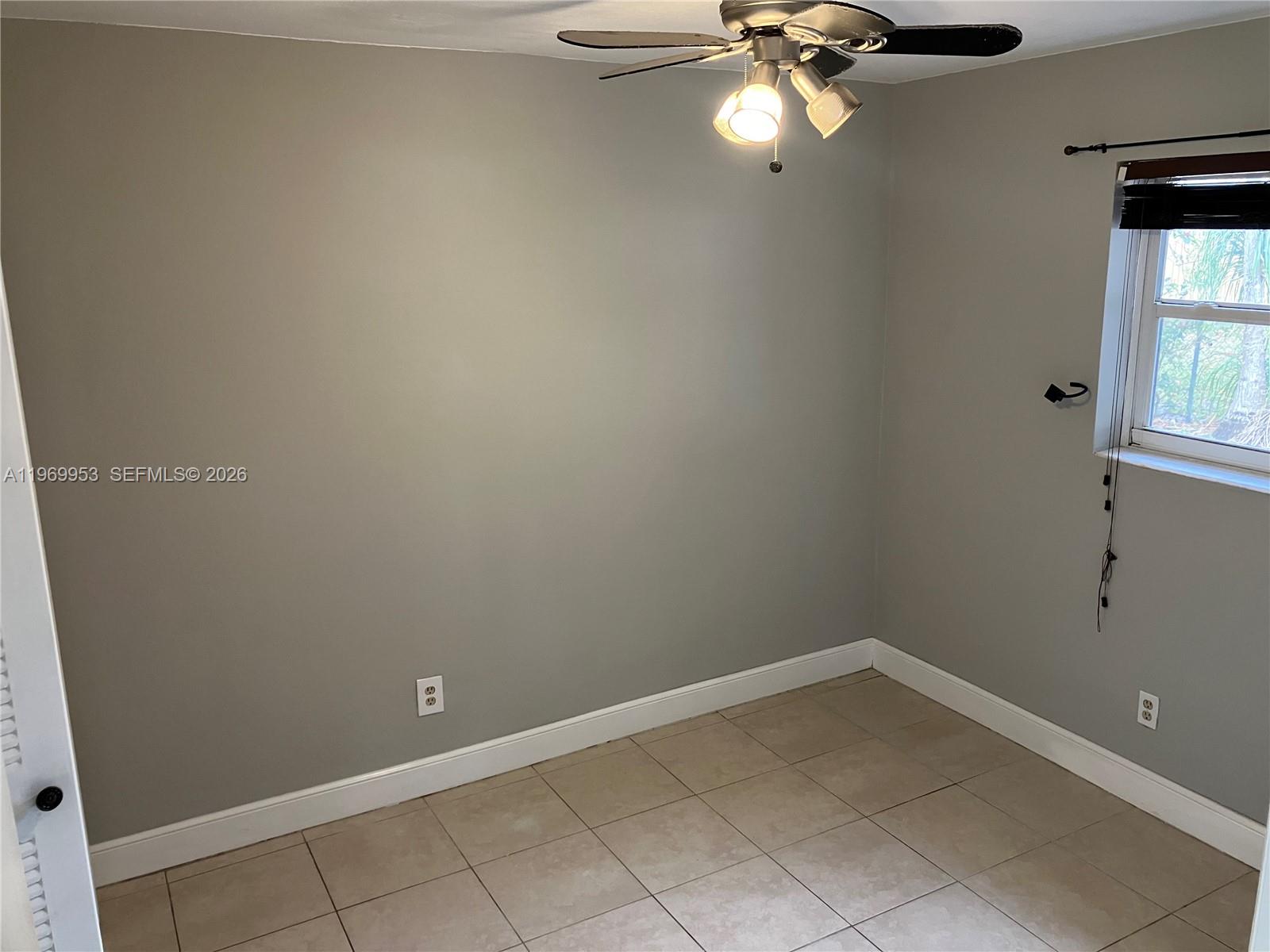 5730 Southwest 37th Street Davie, FL 33314 - Photo 7 of 20 a view of a room with a fan and a window
