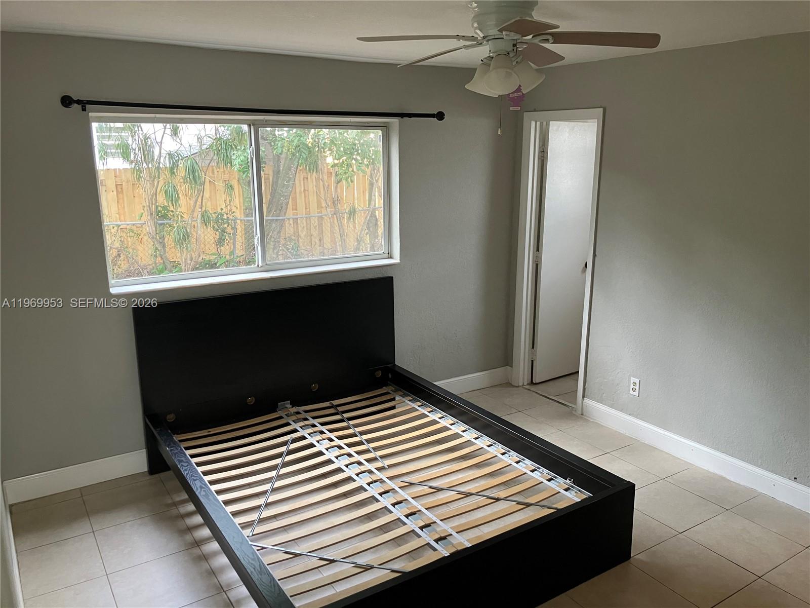 5730 Southwest 37th Street Davie, FL 33314 - Photo 8 of 20 a view of room with window and hardwood