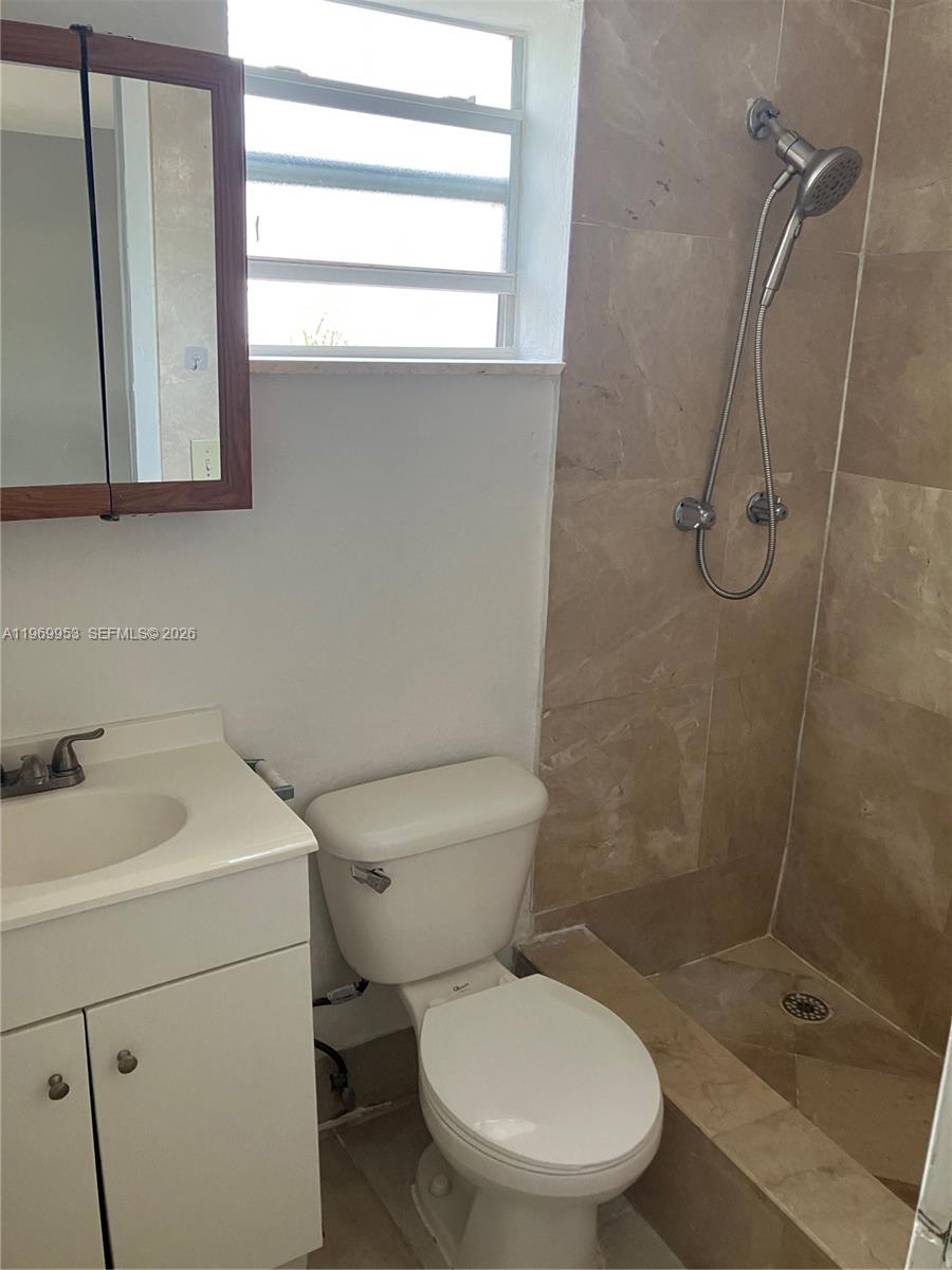 5730 Southwest 37th Street Davie, FL 33314 - Photo 10 of 20 a bathroom with a toilet sink and shower