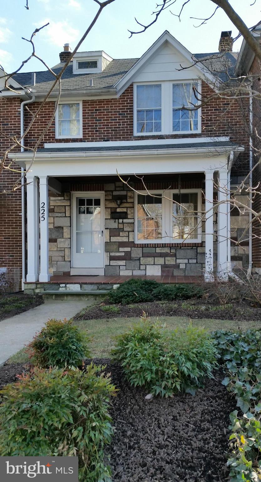 225 Hopkins Road Baltimore, MD 21212 - Photo 1 of 28 a front view of a house with a garden