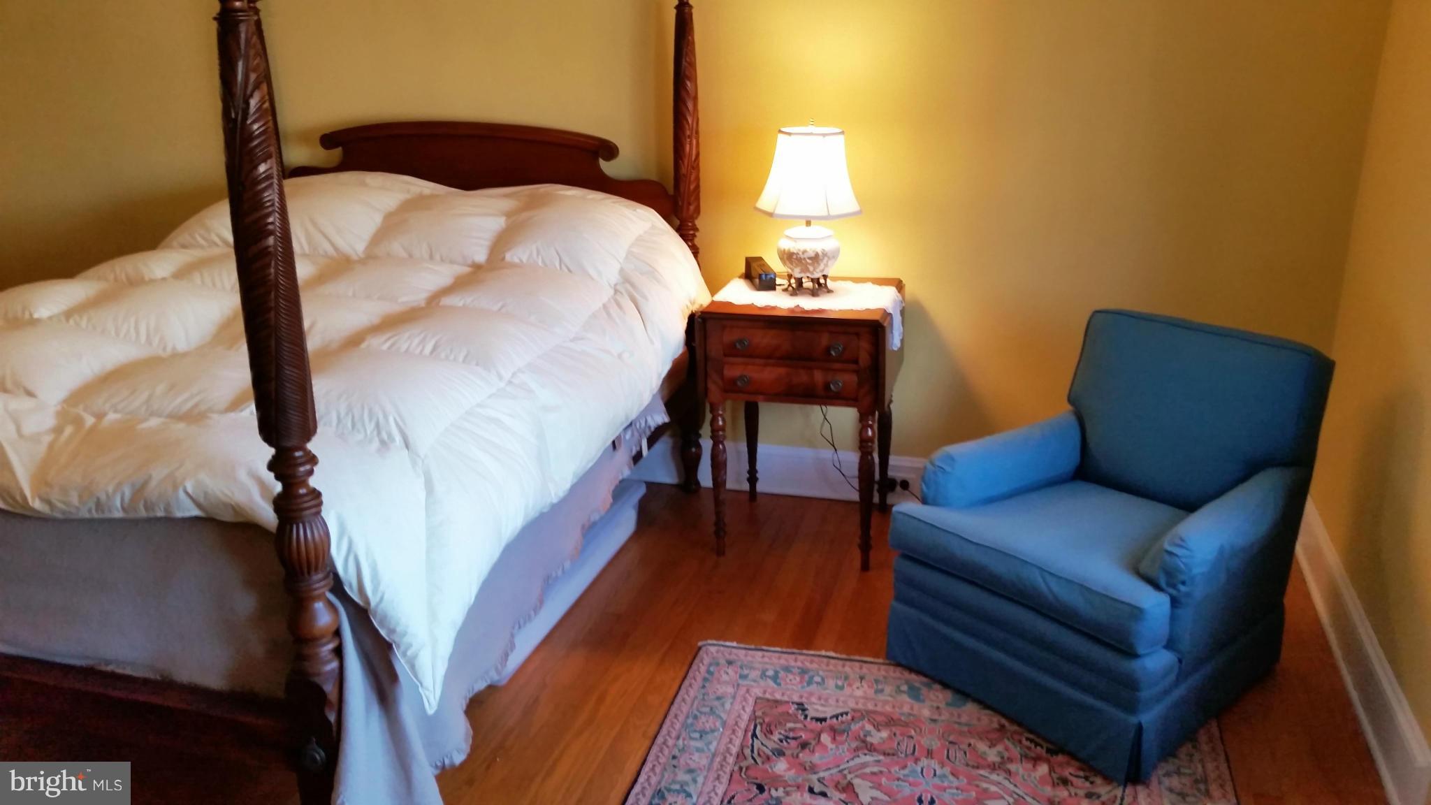 225 Hopkins Road Baltimore, MD 21212 - Photo 12 of 28 a bedroom with furniture and a wooden floor