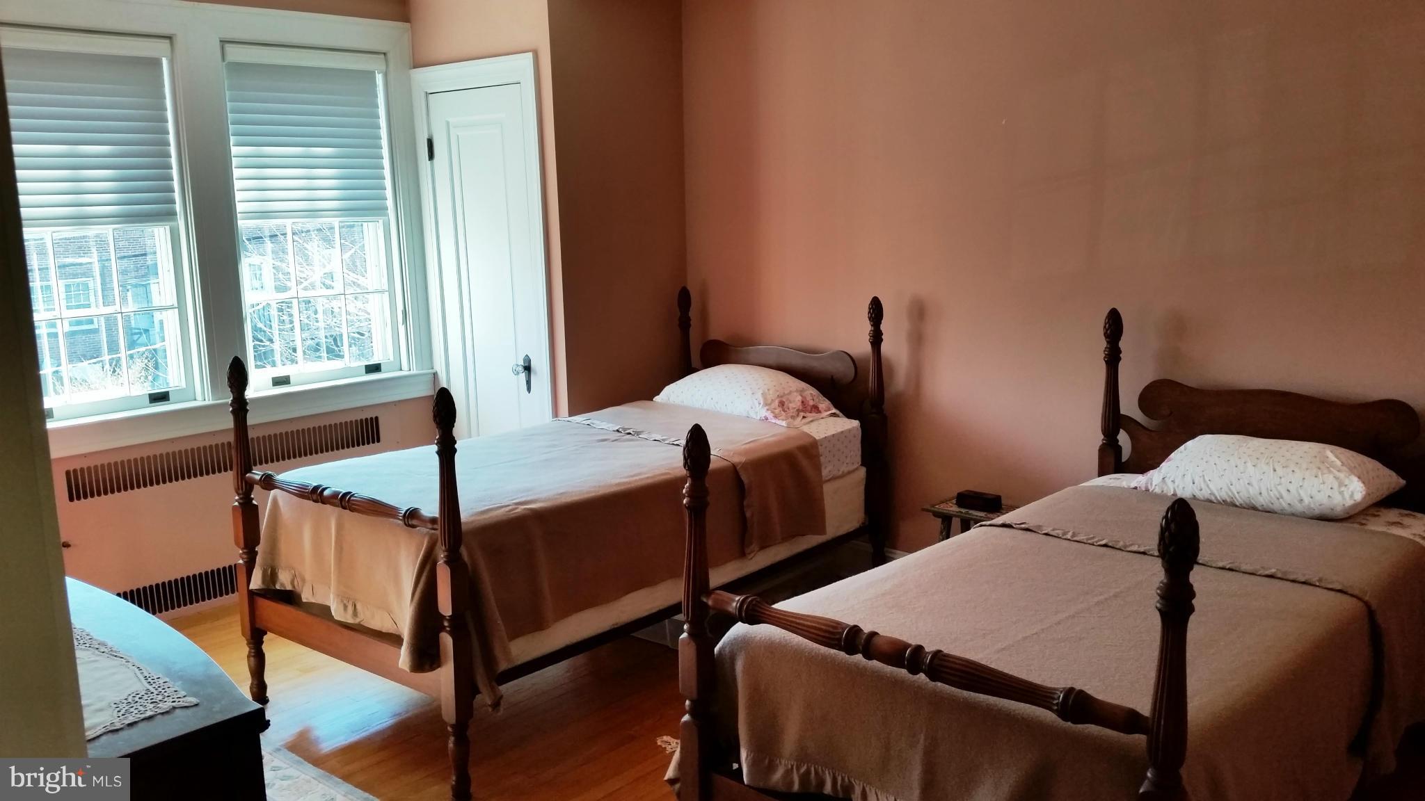 225 Hopkins Road Baltimore, MD 21212 - Photo 14 of 28 a bedroom with two beds and a window