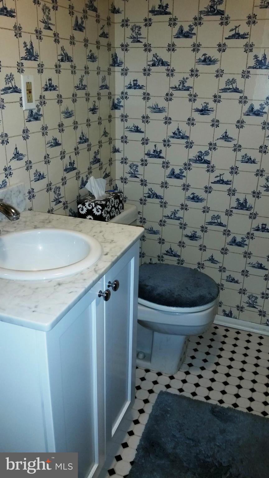 225 Hopkins Road Baltimore, MD 21212 - Photo 25 of 28 a bathroom with a toilet and a shower