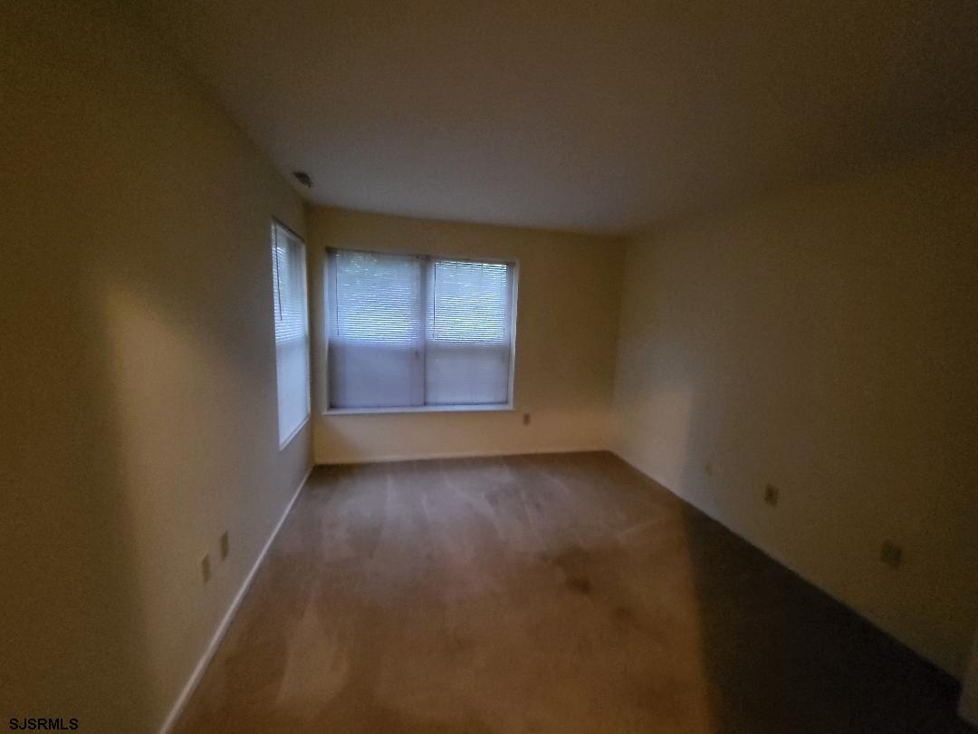 9 Malibu Way, Unit 9 Galloway Township, NJ 08205 - Photo 5 of 6 an empty room with windows