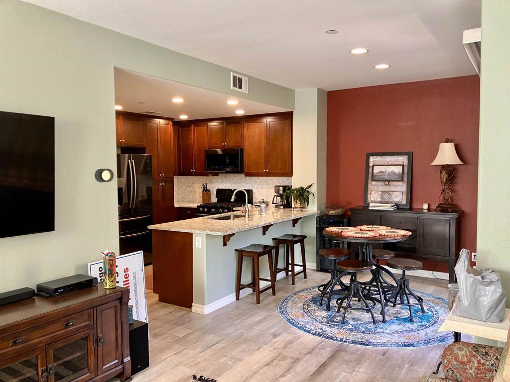 a kitchen with a table and chairs